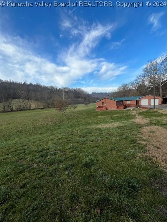 view of yard with a rural view