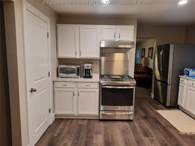 kitchen featuring white cabinets, dark wood-type flooring, and appliances with stainless steel finishes