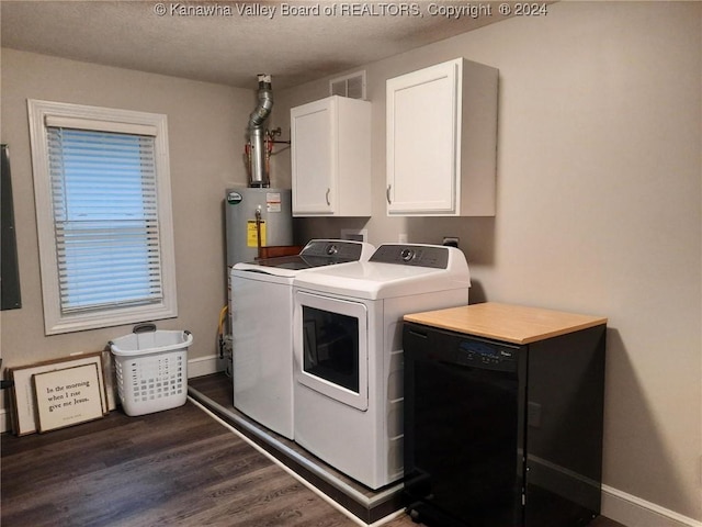 laundry room with dark wood-type flooring, cabinets, a textured ceiling, and independent washer and dryer