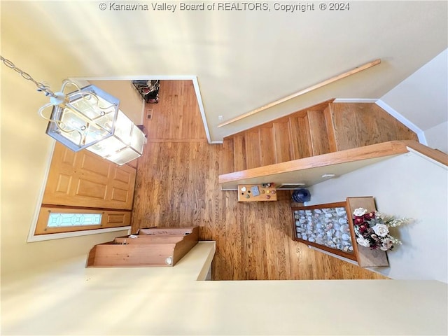 entryway featuring wood walls