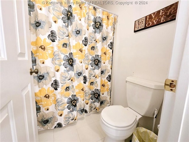 bathroom featuring tile patterned flooring and toilet