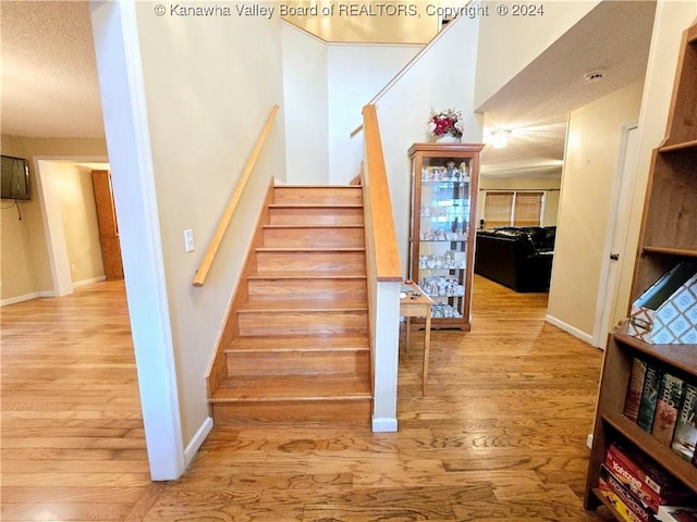 staircase featuring hardwood / wood-style flooring