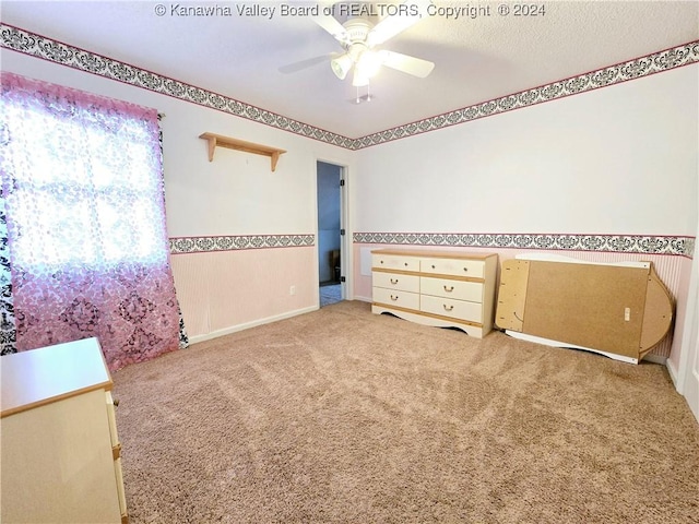 unfurnished bedroom with ceiling fan and light carpet