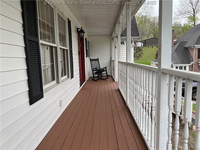 wooden terrace featuring a porch