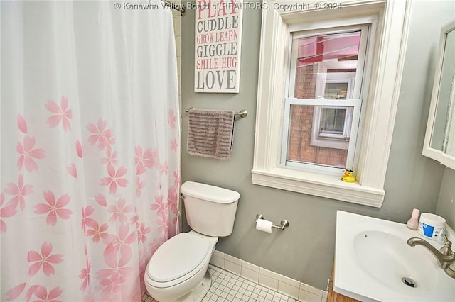 full bathroom featuring vanity, a shower with shower curtain, baseboards, tile patterned flooring, and toilet