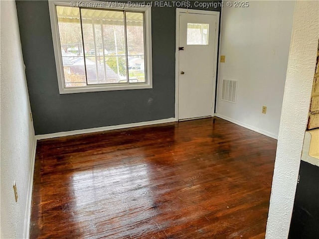 foyer entrance featuring dark hardwood / wood-style flooring