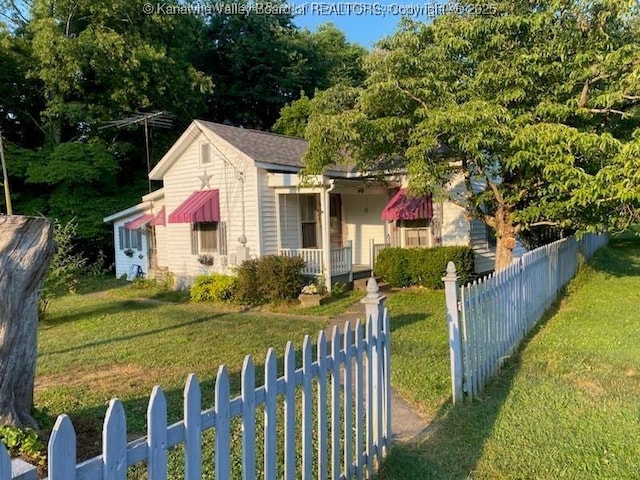 bungalow-style home featuring covered porch and a front lawn