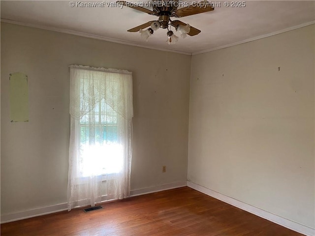 spare room featuring ceiling fan, crown molding, and hardwood / wood-style flooring