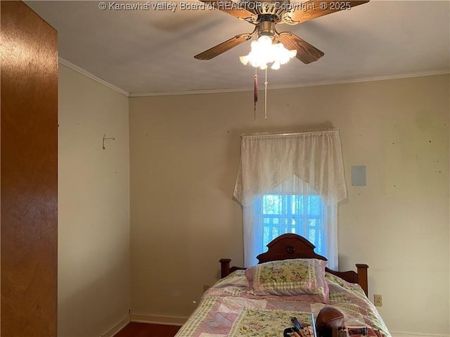 bedroom featuring ceiling fan and crown molding