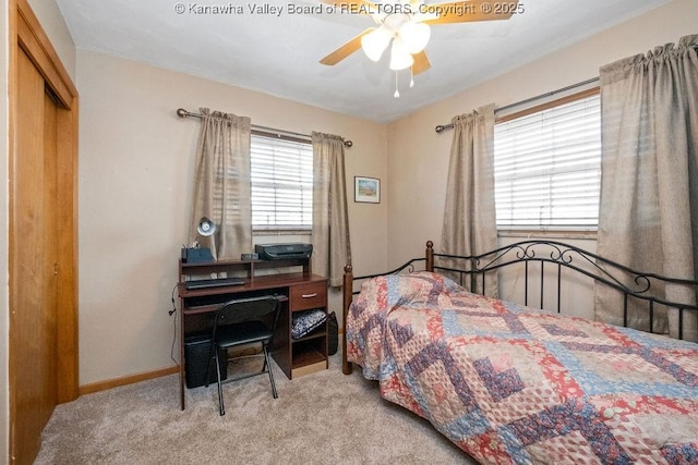 bedroom featuring ceiling fan, a closet, and light colored carpet