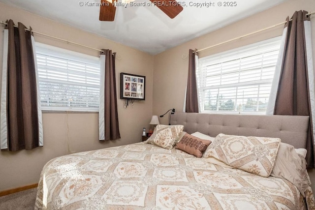 bedroom featuring carpet flooring, multiple windows, and ceiling fan