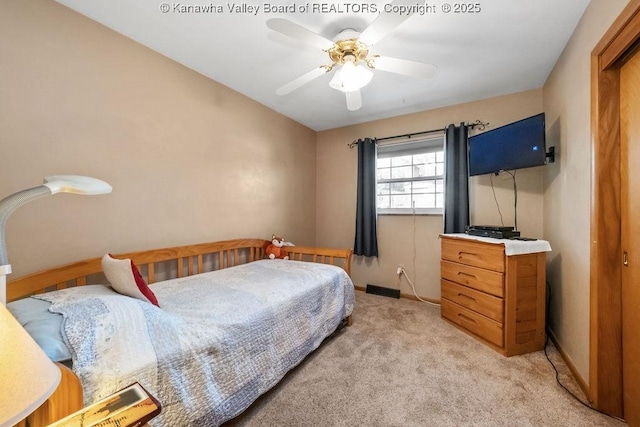 carpeted bedroom with ceiling fan