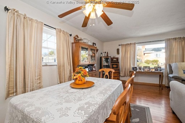 dining room featuring dark hardwood / wood-style floors and ceiling fan