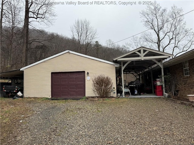 garage featuring a carport