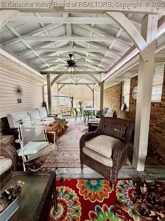 view of patio with outdoor lounge area and ceiling fan