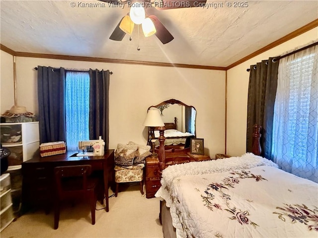 carpeted bedroom with a textured ceiling, ceiling fan, and crown molding