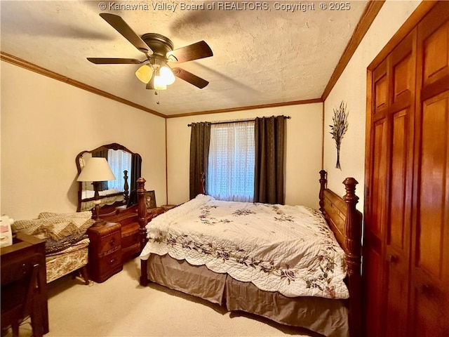 bedroom featuring a textured ceiling, carpet floors, ceiling fan, and crown molding