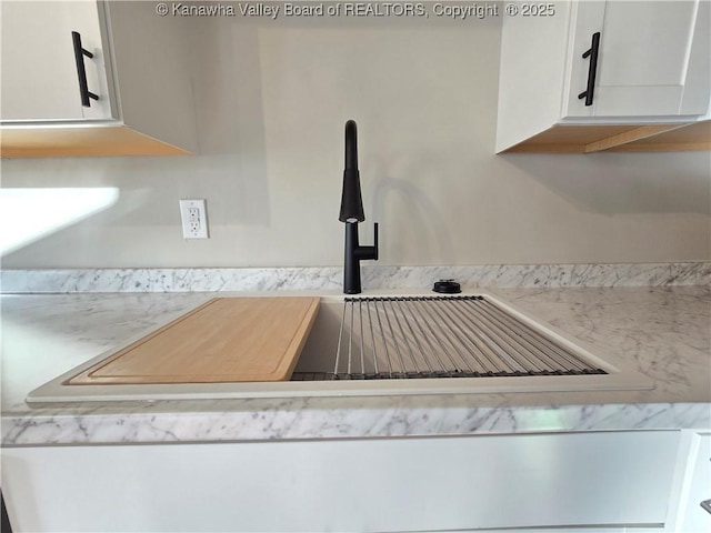 room details with sink and white cabinets