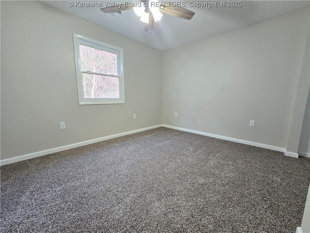 carpeted empty room featuring a textured ceiling and ceiling fan