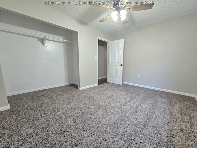 unfurnished bedroom featuring ceiling fan, a closet, carpet floors, and a textured ceiling