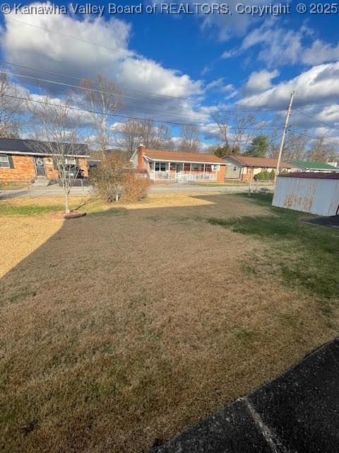 view of yard with covered porch