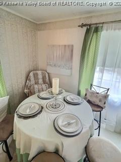 dining room featuring ornamental molding