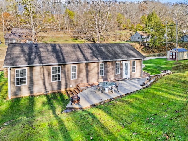 back of property featuring a yard and a patio