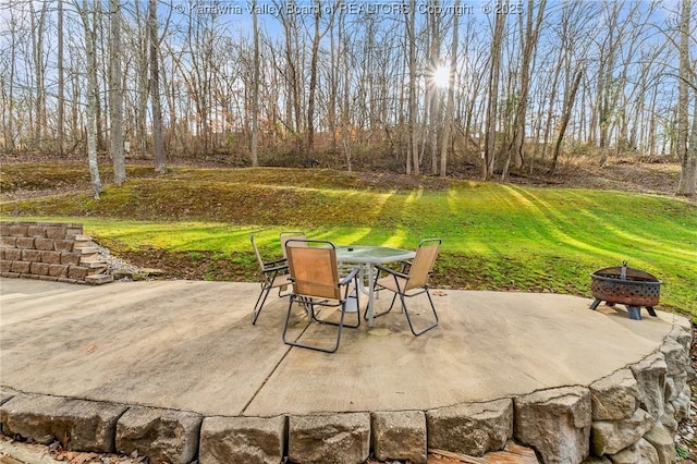 view of patio / terrace with a fire pit