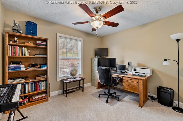 office with a textured ceiling, light colored carpet, and ceiling fan