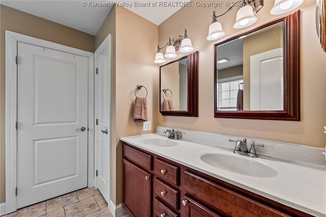 bathroom featuring tile patterned floors and vanity