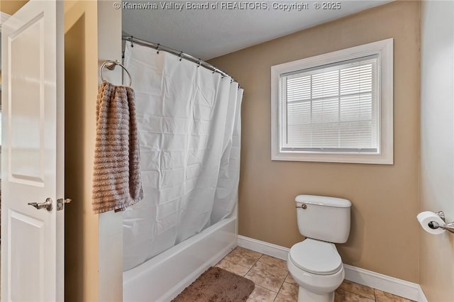 bathroom with tile patterned floors, shower / bath combo, and toilet