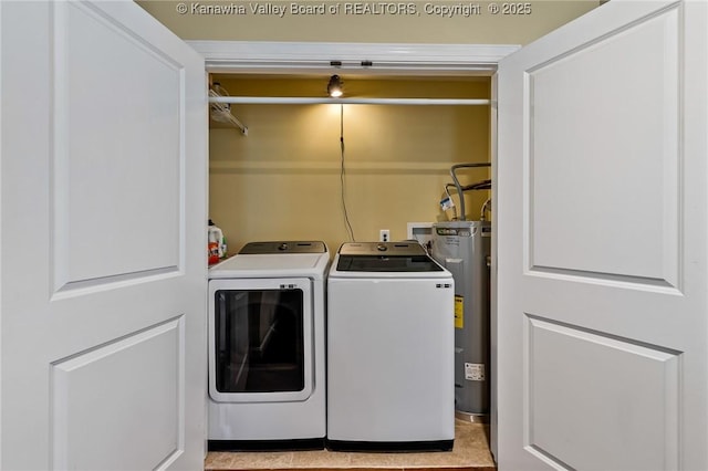 laundry area with washer and dryer and water heater