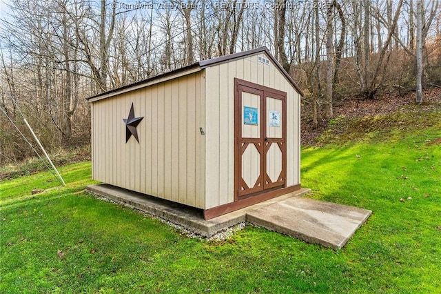 view of outbuilding with a lawn