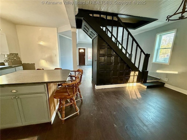 interior space featuring dark hardwood / wood-style flooring and a healthy amount of sunlight