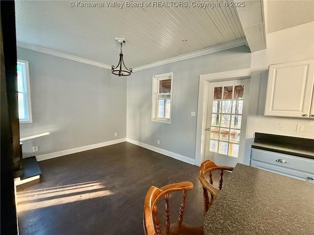 unfurnished dining area with dark hardwood / wood-style flooring and crown molding