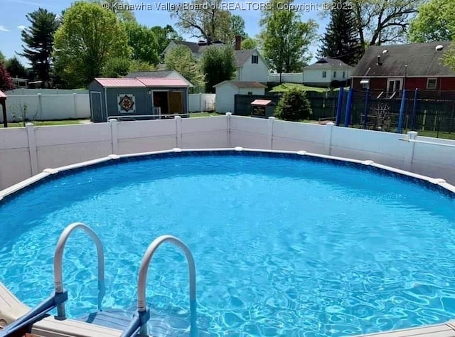 view of pool with a storage unit