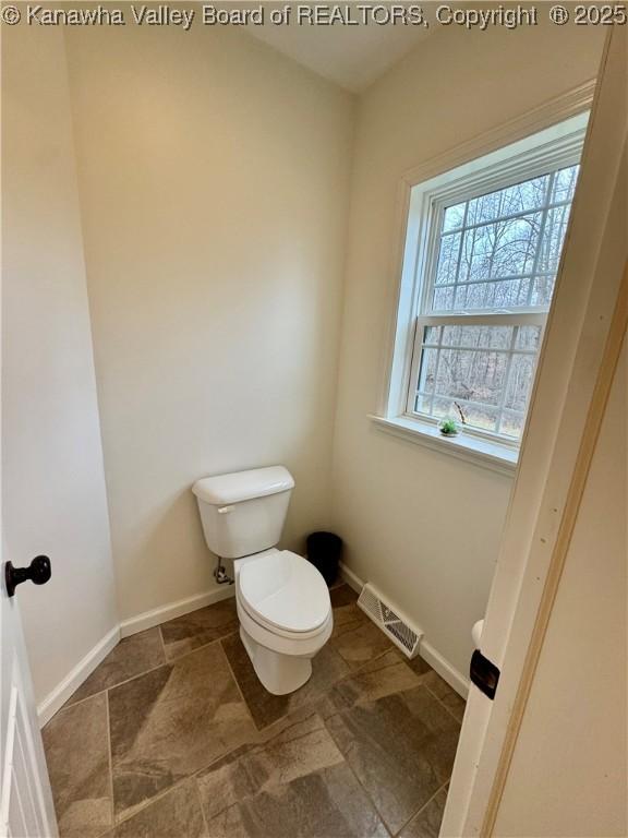 bathroom featuring toilet