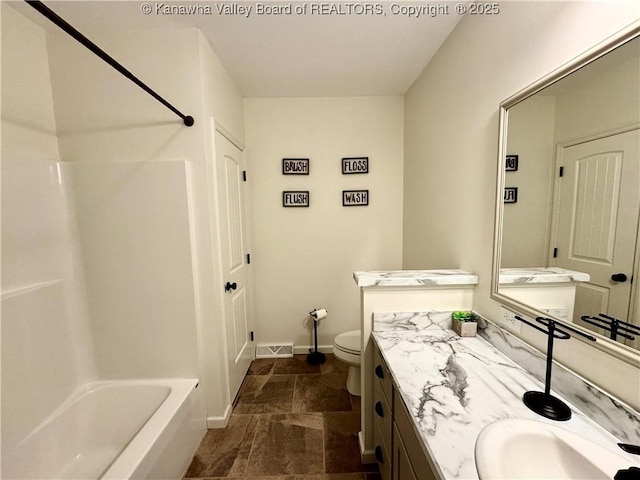 full bathroom with vanity,  shower combination, and toilet