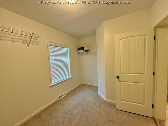 interior space featuring light colored carpet