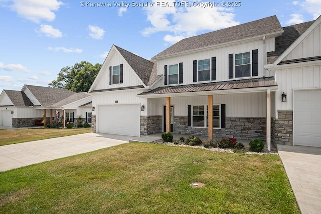 view of front of home featuring covered porch, a front yard, and a garage