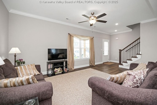 living room featuring dark wood-type flooring, ceiling fan, and crown molding