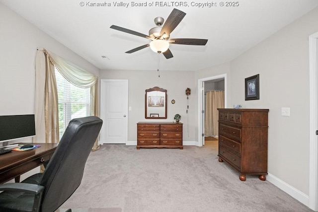 office space featuring ceiling fan and light colored carpet