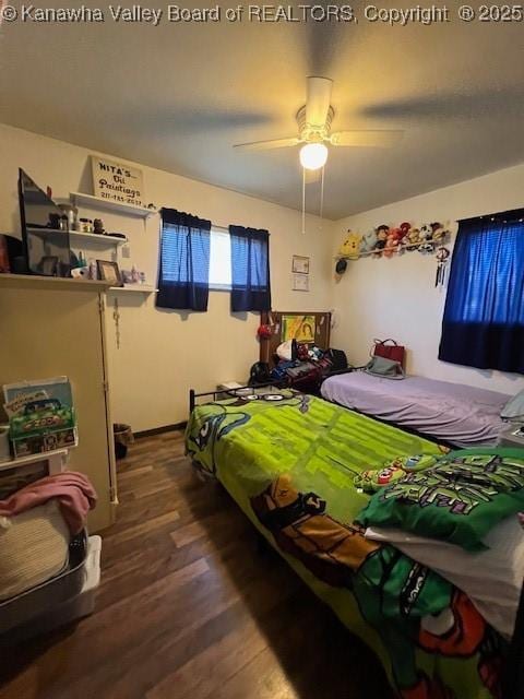 bedroom featuring ceiling fan and wood-type flooring