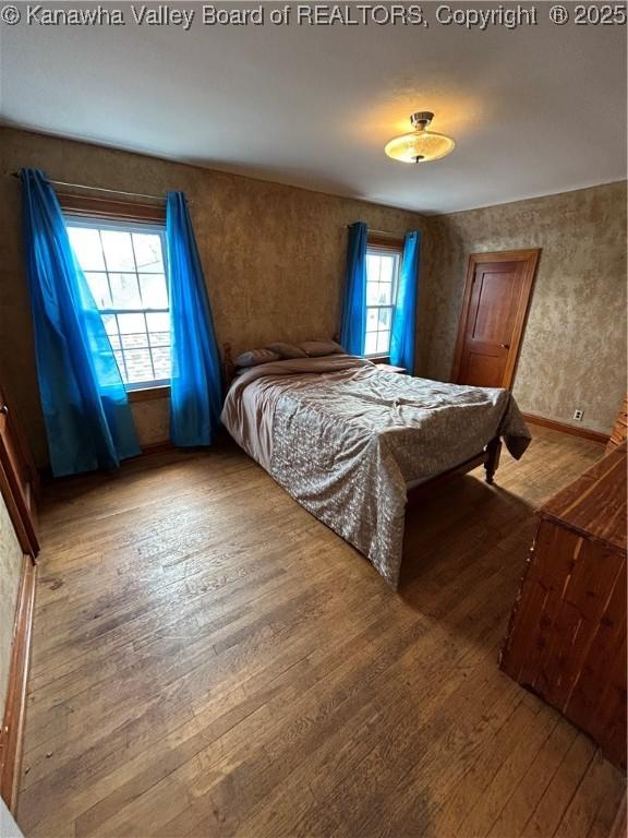 bedroom with wood-type flooring