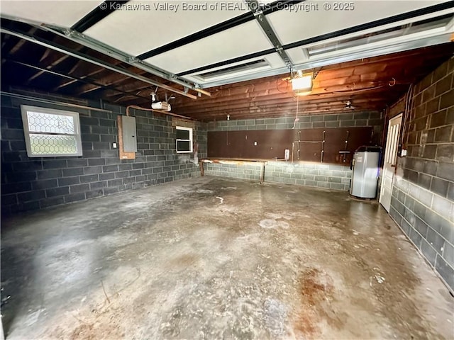 garage with electric panel, a garage door opener, and water heater