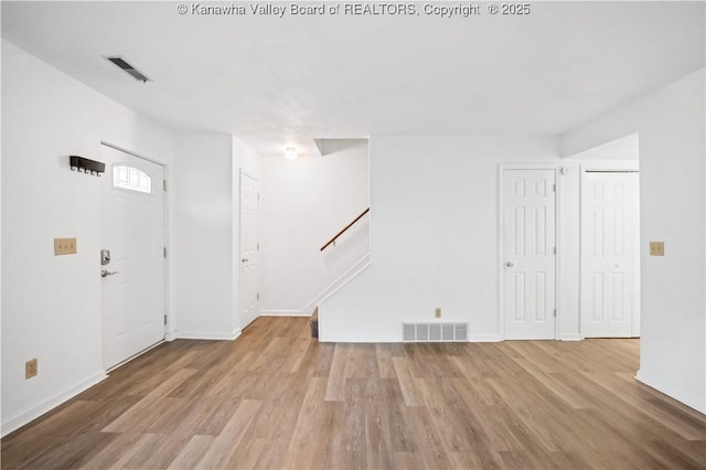 foyer with light wood-type flooring