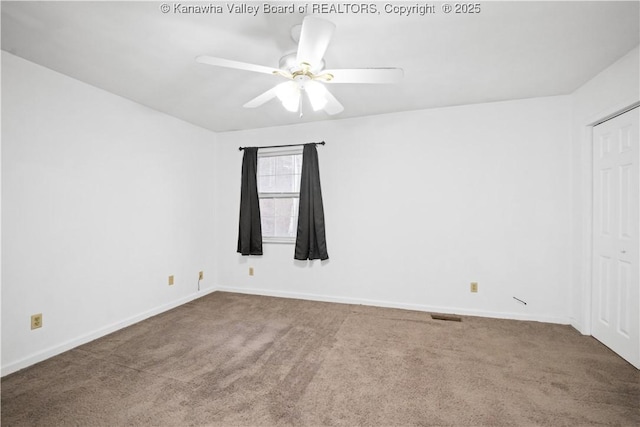 unfurnished room featuring carpet and ceiling fan