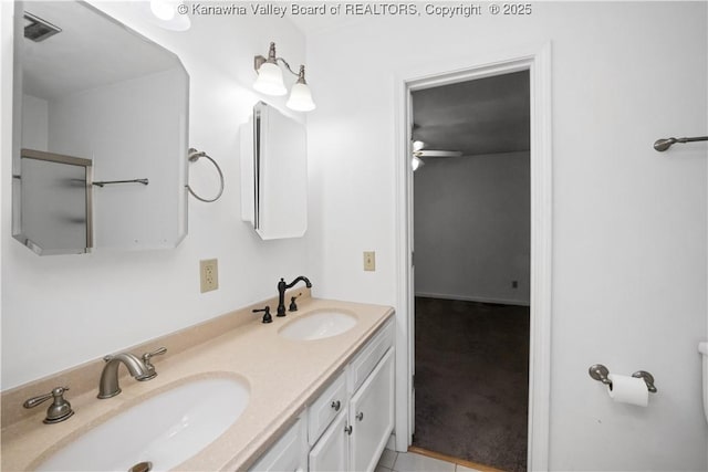 bathroom featuring tile patterned flooring, ceiling fan, and vanity