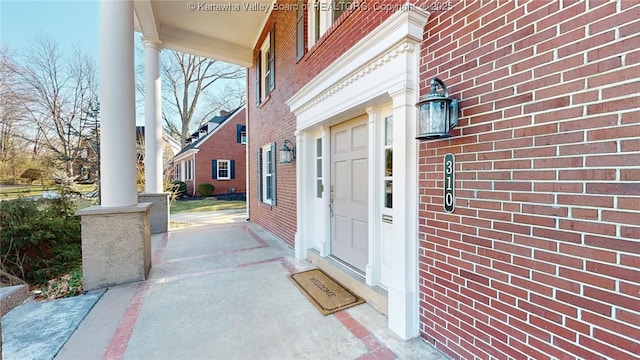 view of exterior entry featuring a porch