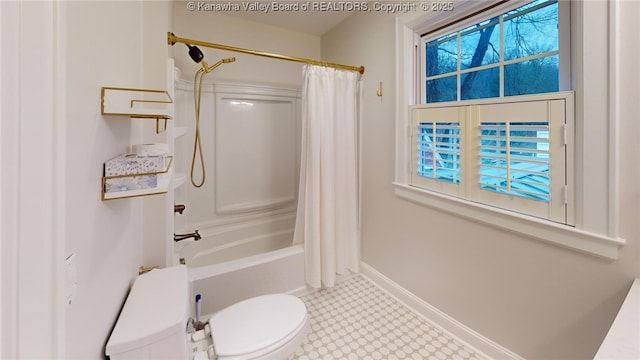 bathroom featuring toilet, a wealth of natural light, and shower / bath combo with shower curtain